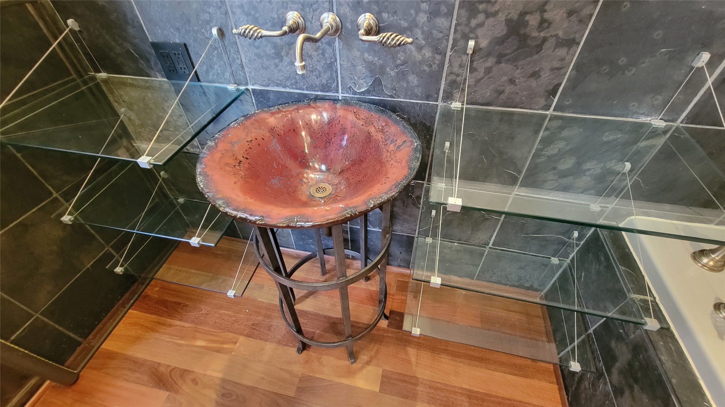 711 Main Street, Unit PH 1003 Houston, TX 77002 - Photo 13 of 32 Primary bath art glass sink with designer custom metal pedestal. Unique glass shelves.