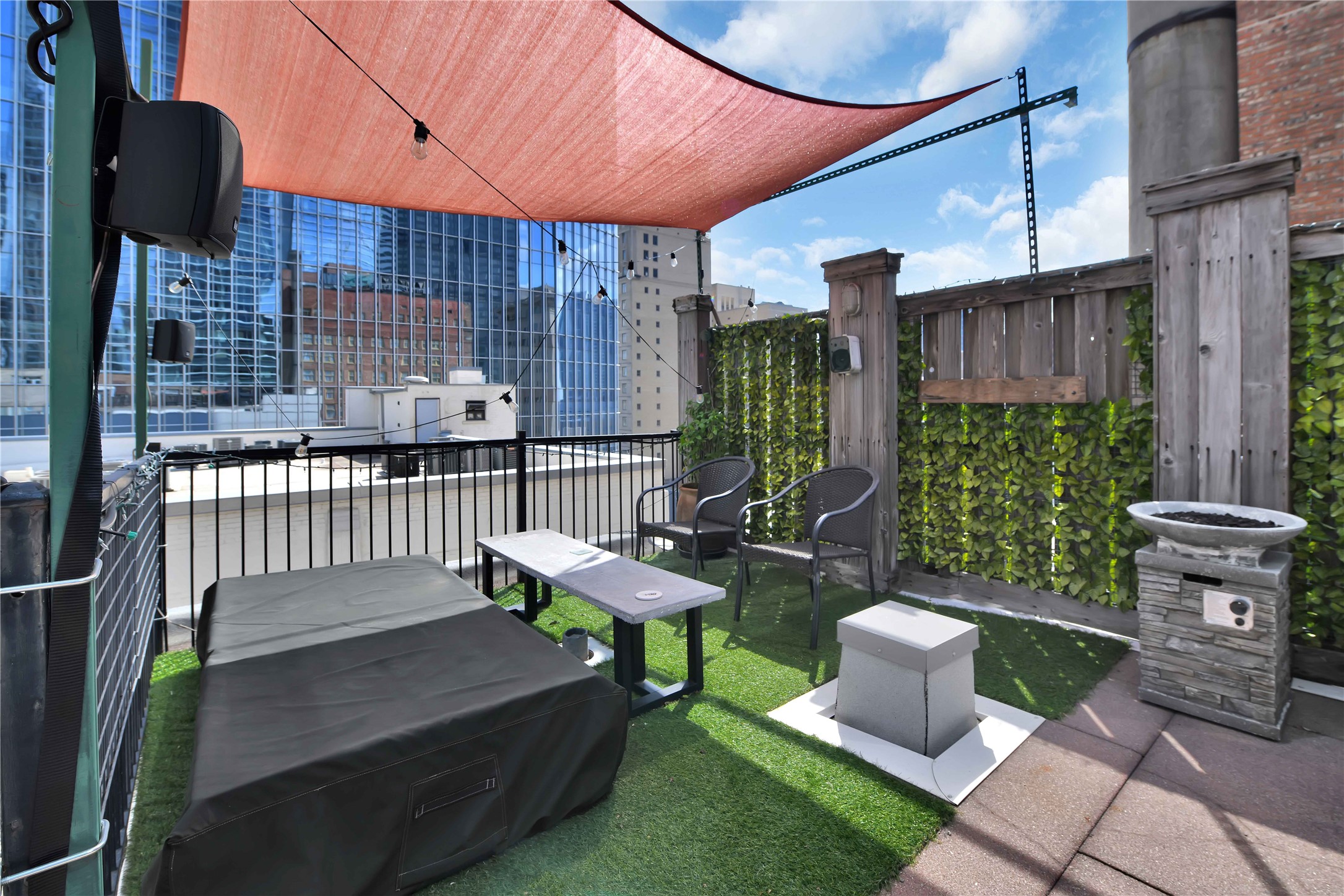 711 Main Street, Unit PH 1003 Houston, TX 77002 - Photo 24 of 32 Corner sitting area on private roof terrace. Furniture and most accessories remain.