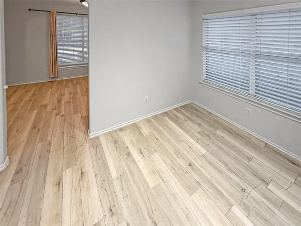 a view of a room with wooden floor and small space