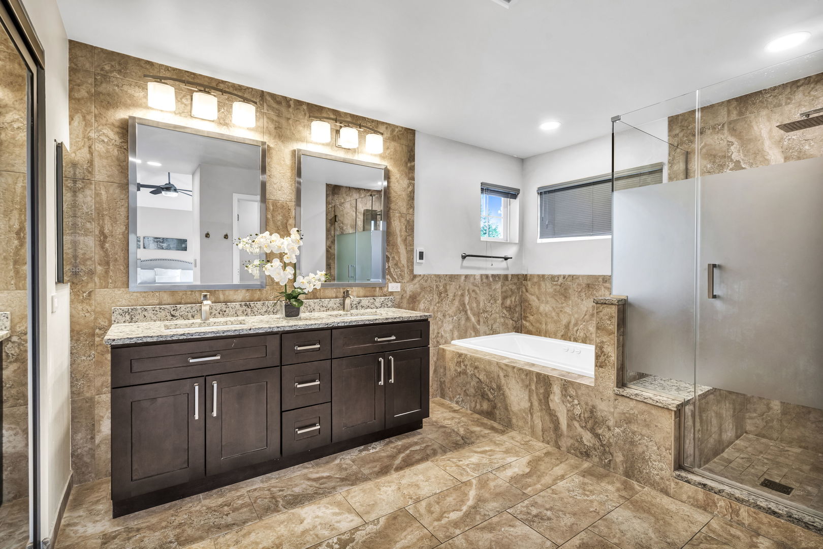 2241 Avalon Court South Buffalo Grove, IL 60089 - Photo 11 of 25 a spacious bathroom with a tub sink and mirror