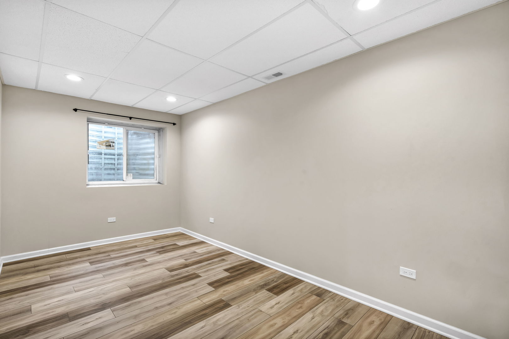 2241 Avalon Court South Buffalo Grove, IL 60089 - Photo 20 of 25 a view of a big room with wooden floor and windows