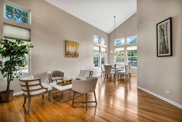 a dining room with furniture and wooden floor