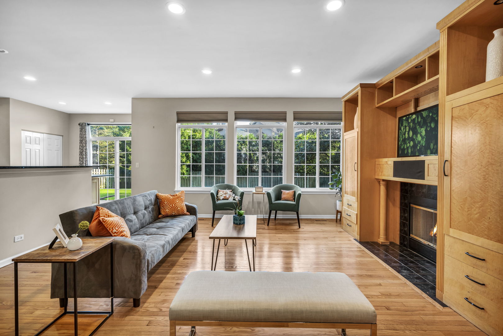 2241 Avalon Court South Buffalo Grove, IL 60089 - Photo 6 of 25 a living room with furniture a large window and wooden floor