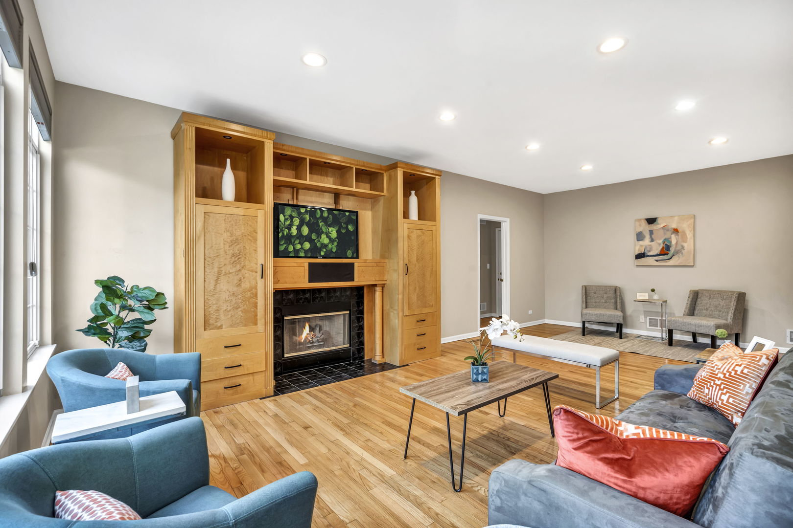 2241 Avalon Court South Buffalo Grove, IL 60089 - Photo 7 of 25 a living room with furniture wooden floor and a fireplace