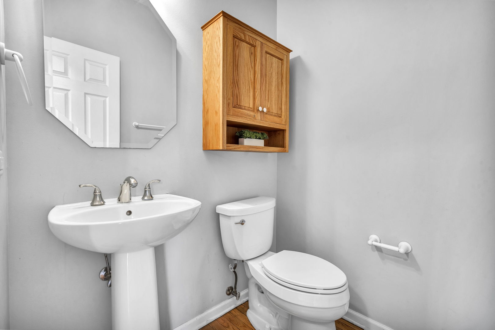 2241 Avalon Court South Buffalo Grove, IL 60089 - Photo 9 of 25 a bathroom with a toilet sink and mirror