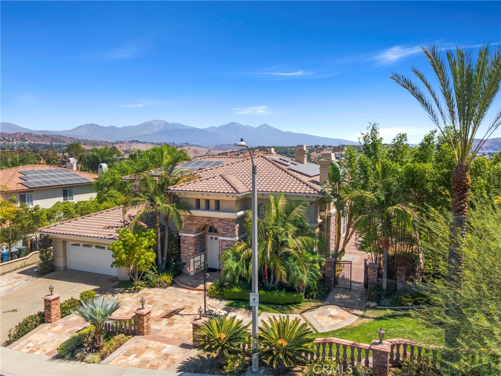 a view of a chairs and table in backyard