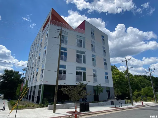 a view of a building with a street