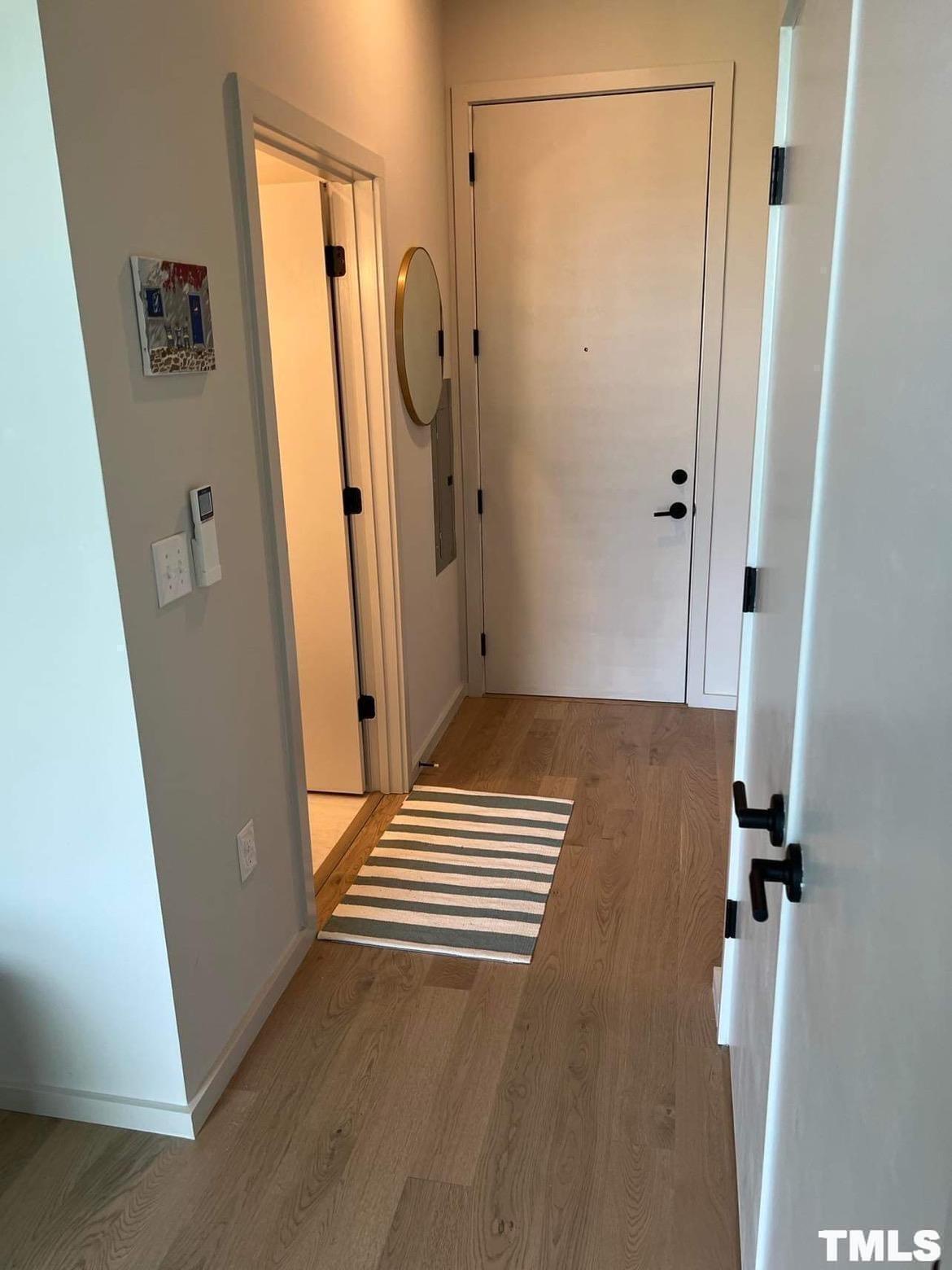 600 South Duke Street, Unit 15 Durham, NC 27701 - Photo 11 of 20 a view of a storage and utility room with a washing machine in a room