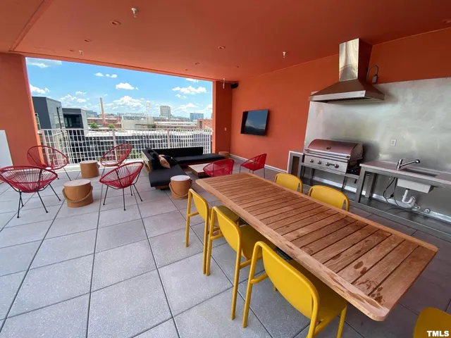 a wooden bench sitting in front of a building