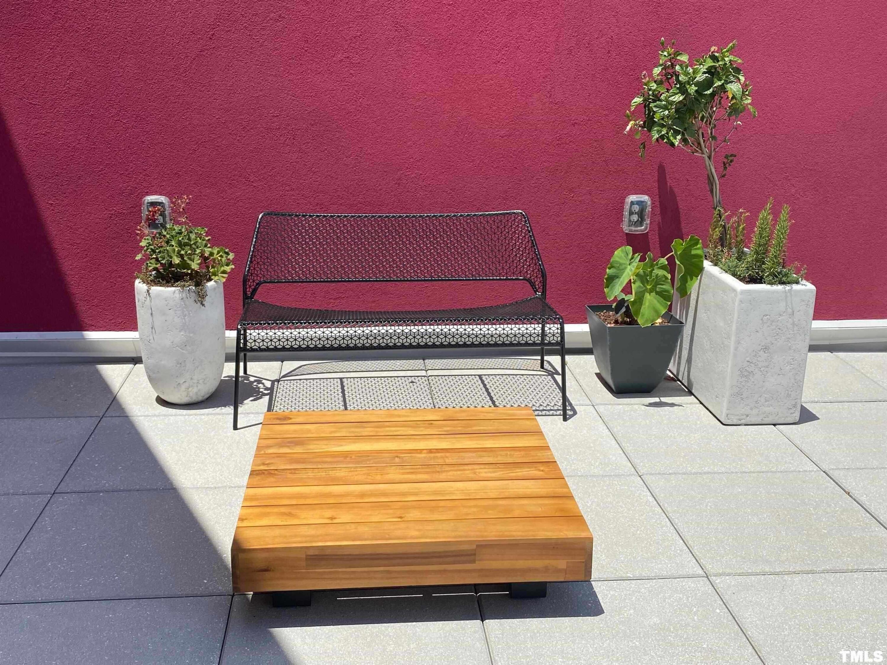 600 South Duke Street, Unit 15 Durham, NC 27701 - Photo 20 of 20 a wooden bench sitting in front of a building