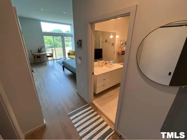 a view of a living room and bathroom