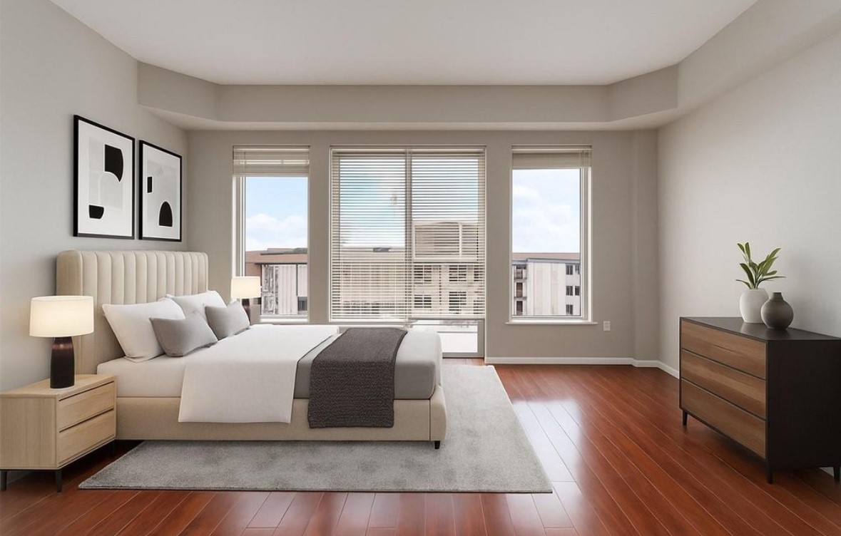 a spacious bedroom with a large bed and a couch