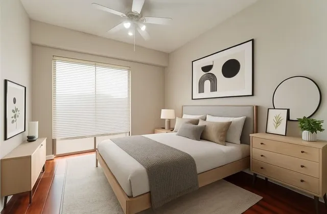 a bedroom with a bed and a dresser