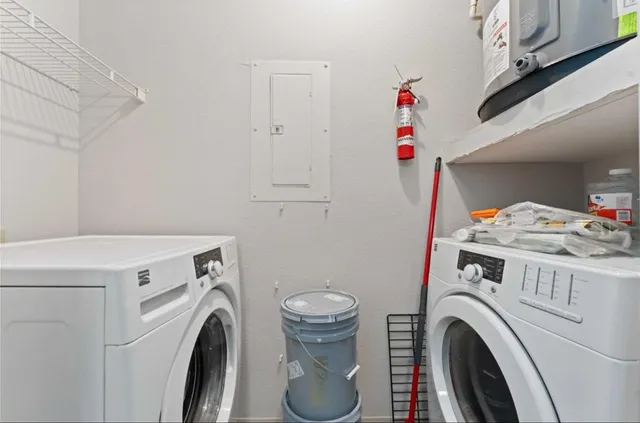 a utility room with dryer and washer