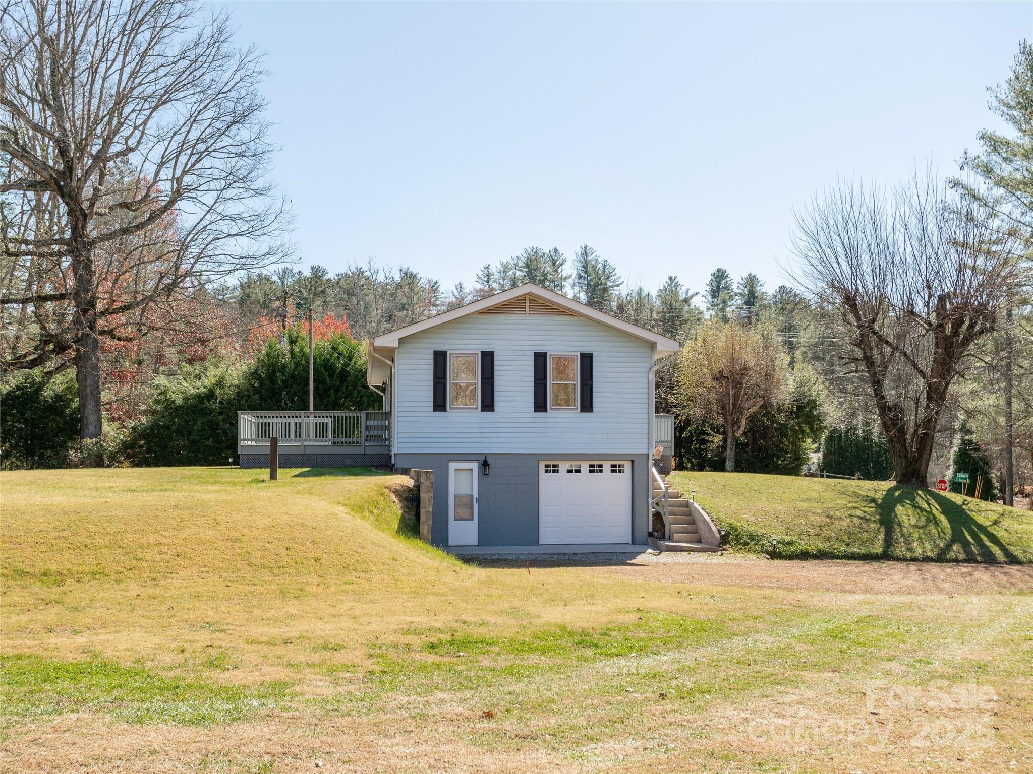3021 Kanuga Road Hendersonville, NC 28739 - Photo 22 of 24 a house view with swimming pool and wooden fence