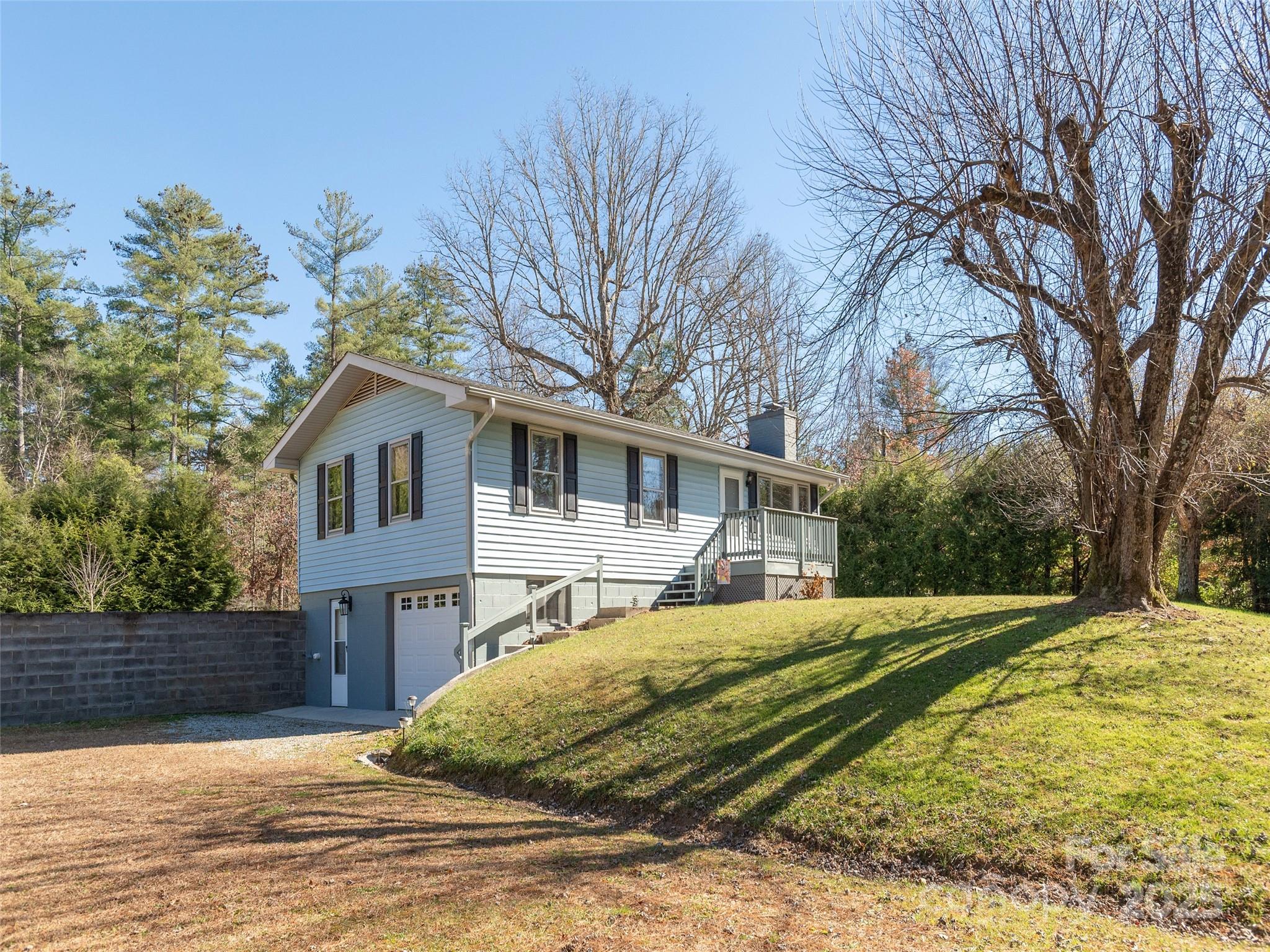3021 Kanuga Road Hendersonville, NC 28739 - Photo 23 of 24 a view of a house with a yard covered in snow