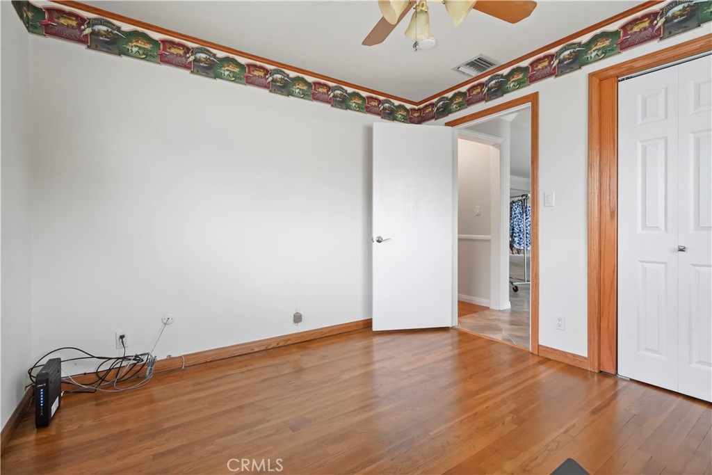 17068 Celtic Street Granada Hills, CA 91344 - Photo 11 of 21 a view of a room with wooden floor and windows