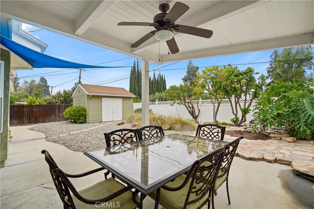 17068 Celtic Street Granada Hills, CA 91344 - Photo 18 of 21 a view of a patio with table and chairs with wooden floor