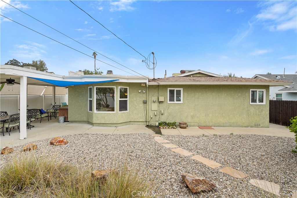 17068 Celtic Street Granada Hills, CA 91344 - Photo 20 of 21 a front view of a house with a garden and yard