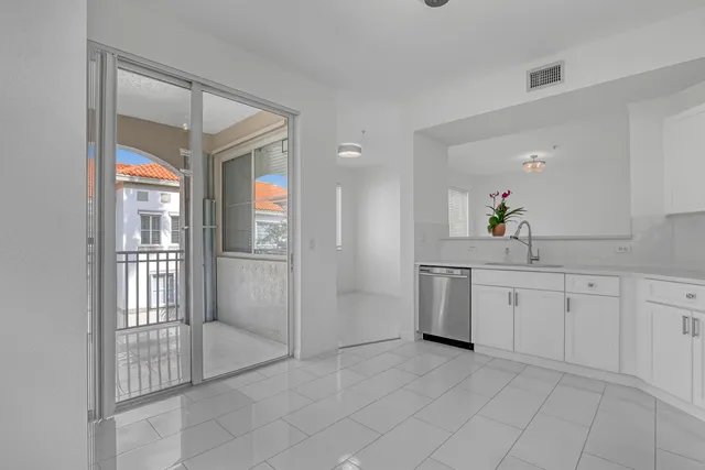 a spacious bathroom with a mirror a bathtub and shower