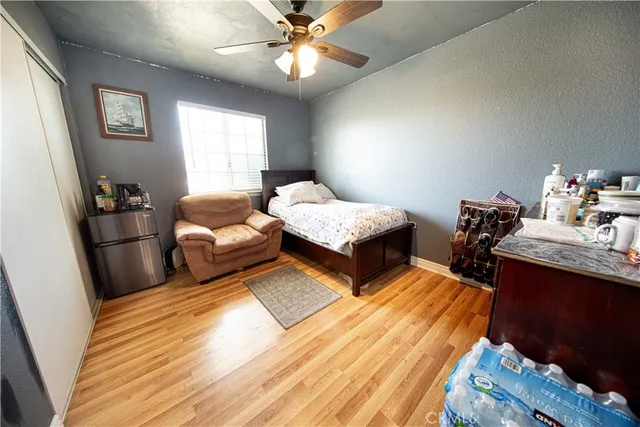 a bedroom with double bed and a chandelier
