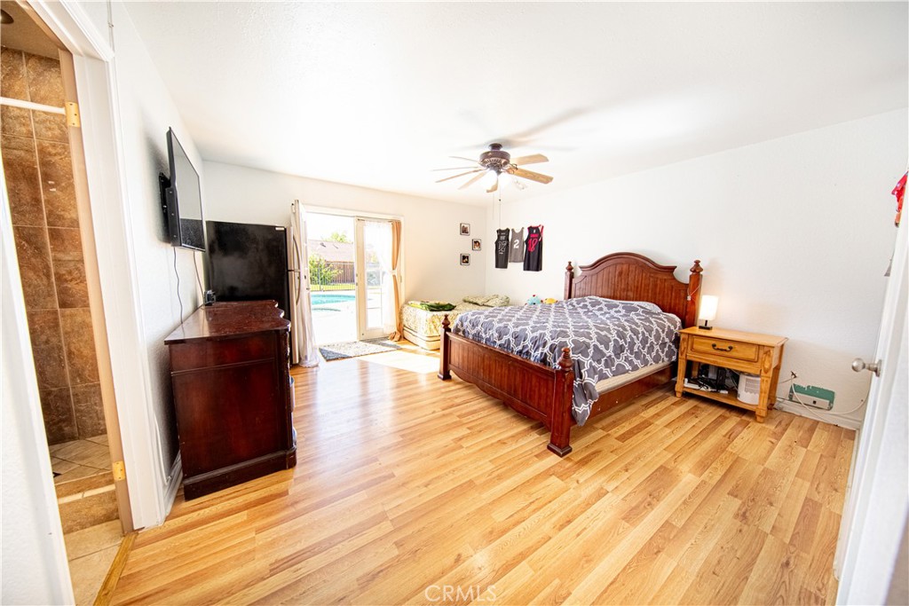 14024 Delaware Road Apple Valley, CA 92307 - Photo 16 of 41 a living room with furniture and a flat screen tv