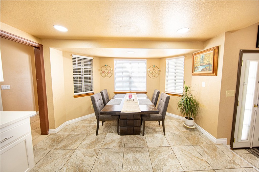 14024 Delaware Road Apple Valley, CA 92307 - Photo 22 of 41 a view of a dining room with furniture and a window