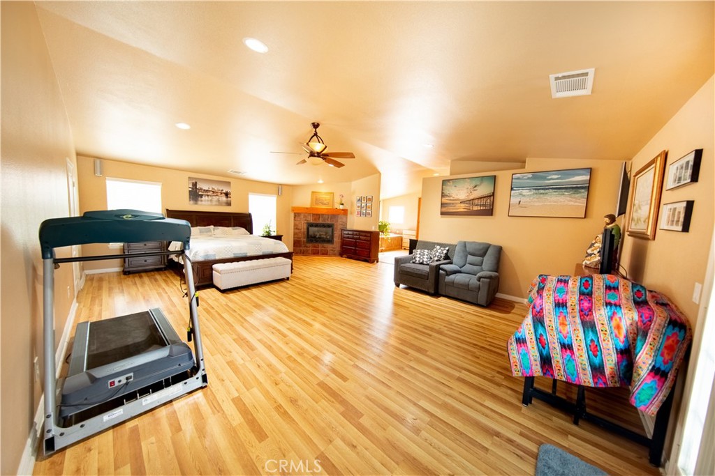 14024 Delaware Road Apple Valley, CA 92307 - Photo 25 of 41 a living room with furniture fireplace and flat screen tv