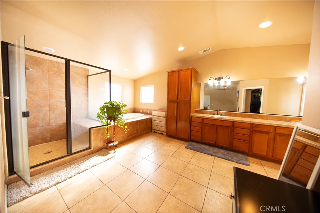 14024 Delaware Road Apple Valley, CA 92307 - Photo 26 of 41 a large white kitchen with a large window