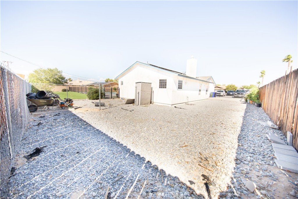 14024 Delaware Road Apple Valley, CA 92307 - Photo 37 of 41 a view of a house with a yard