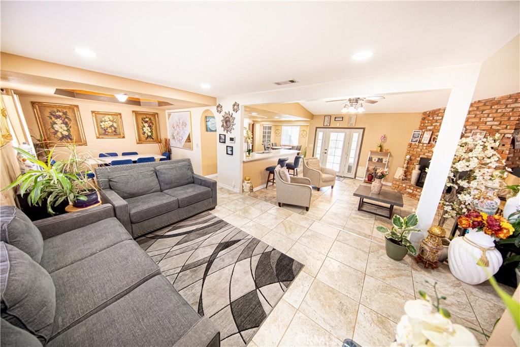 14024 Delaware Road Apple Valley, CA 92307 - Photo 6 of 41 a living room with furniture and a large window