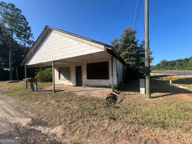 a backyard of a house with seating space