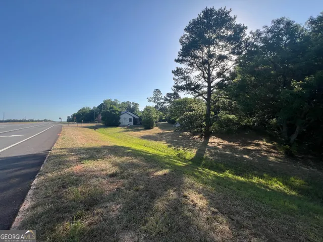 a view of swimming pool with a yard