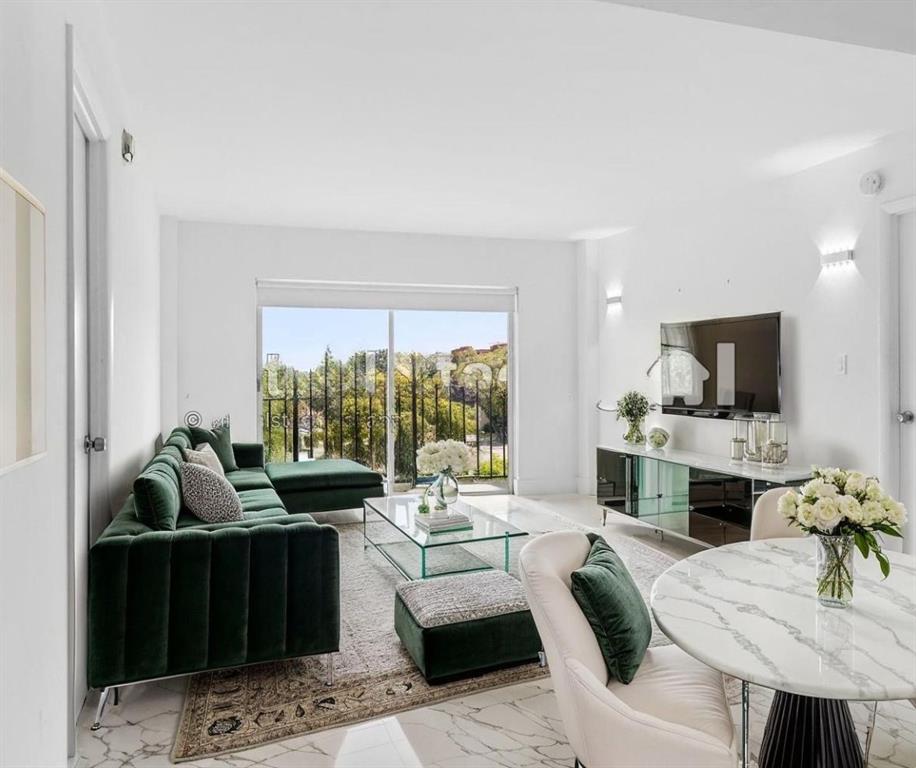 a living room with furniture fireplace and a flat screen tv