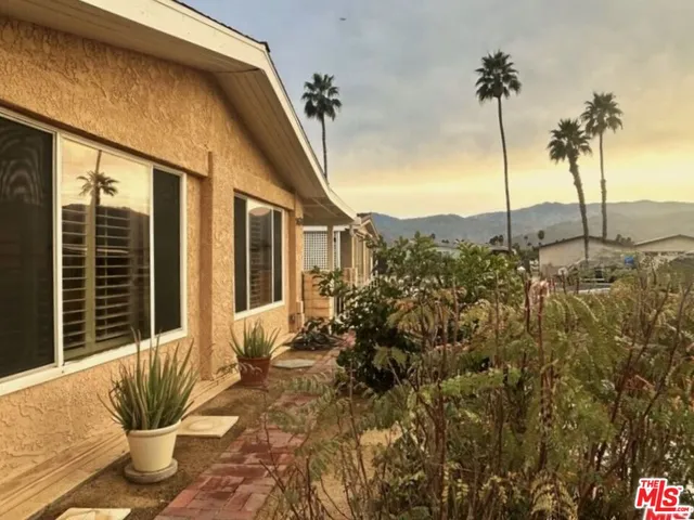 a view of balcony with a potted plant