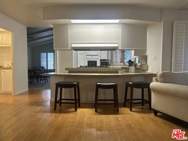 a bathroom with bathtub and window