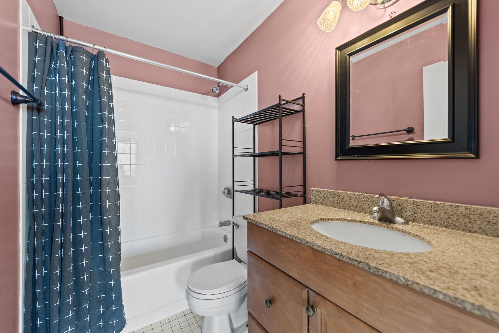 5320 North Sheridan Road, Unit 2201 Chicago, IL 60640 - Photo 11 of 18 a bathroom with a granite countertop sink toilet and shower