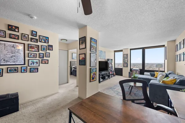 a view of a livingroom with workspace and a couch