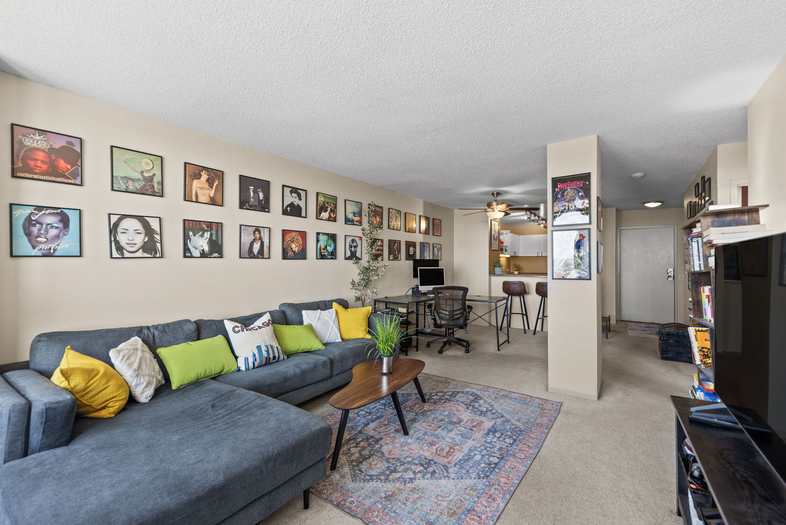 5320 North Sheridan Road, Unit 2201 Chicago, IL 60640 - Photo 7 of 18 a living room with furniture and a flat screen tv