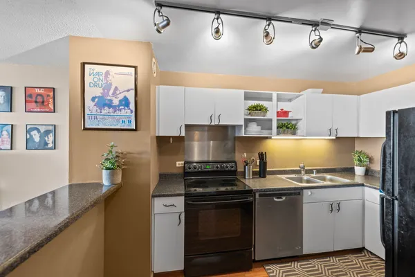 a kitchen with a stove and cabinets