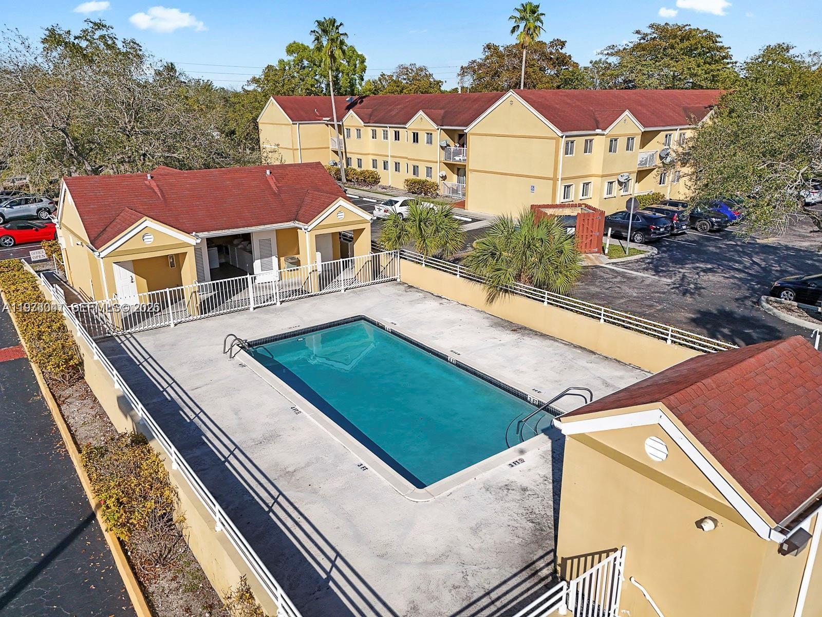 13810 Southwest 112th Street, Unit 110 Miami, FL 33186 - Photo 11 of 11 a view of a house with yard