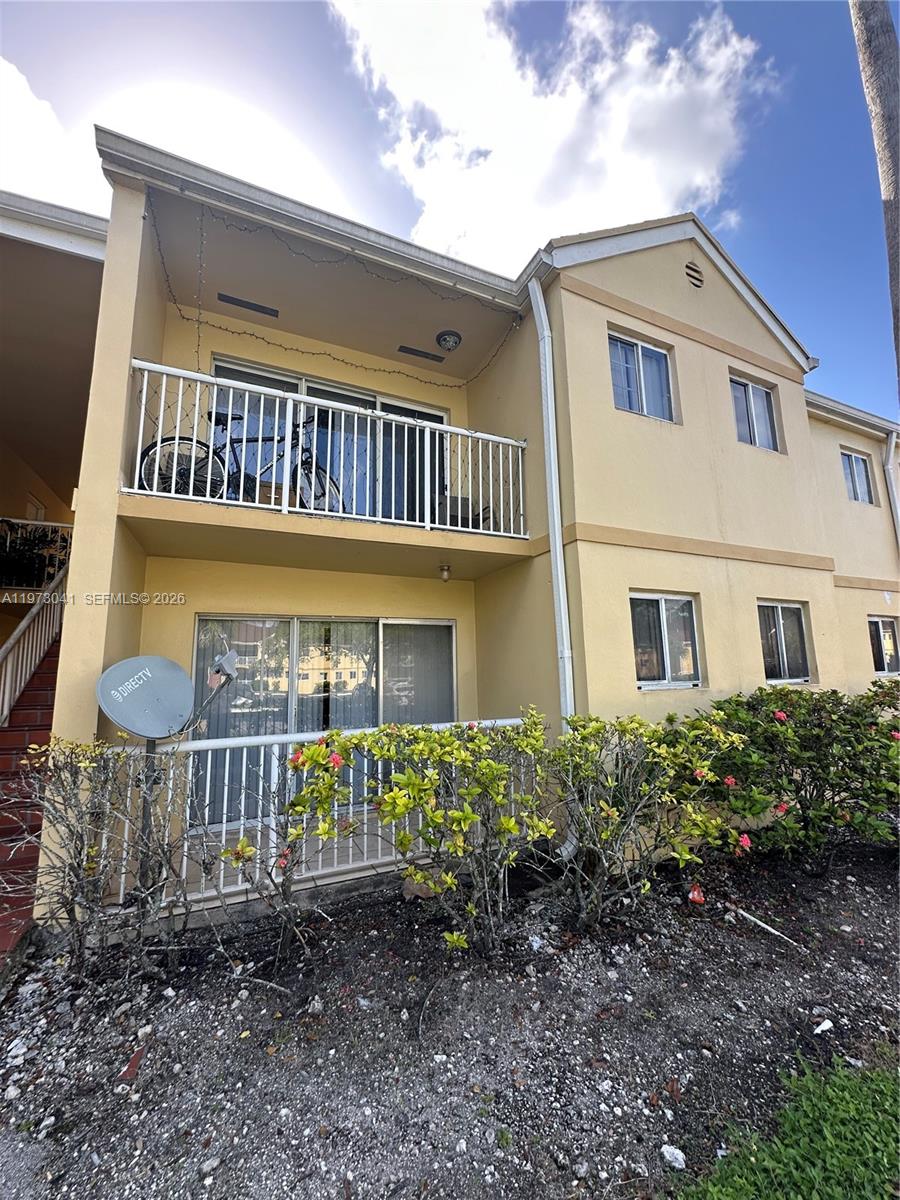 13810 Southwest 112th Street, Unit 110 Miami, FL 33186 - Photo 2 of 11 a front view of a house