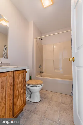 a bathroom with a toilet a sink and bathtub