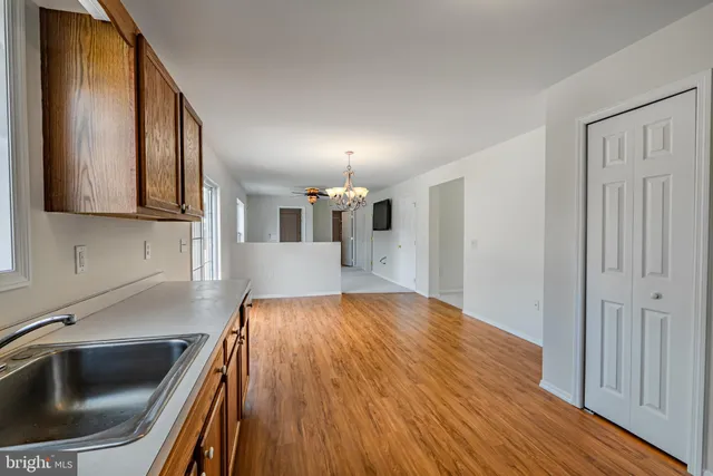 a kitchen with a sink and cabinets