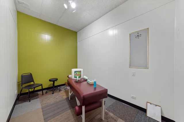 a room with a table and chairs