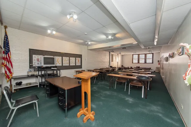a dining room with furniture and a rug