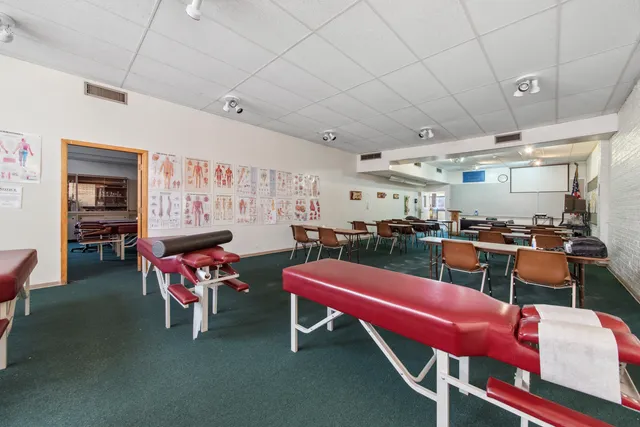 a room with furniture a flat screen tv and a table