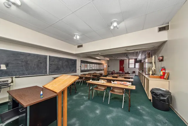 a room with furniture and air hockey table