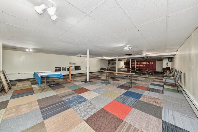 a living room with lots of furniture and a rug