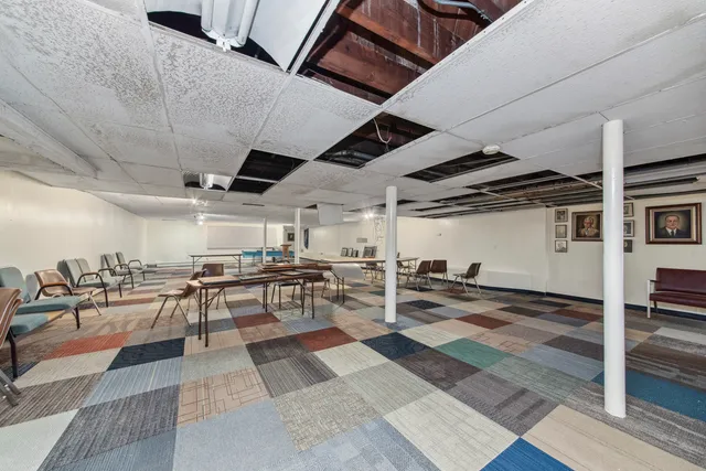 a view of a hall with wooden floor